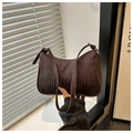 Detail of dark brown faux crocodile leather shoulder bag with golden hardware and zipper - Coffee
