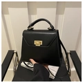 Matte black leather handbag for women featuring gold lock and elegant top handle - Black