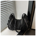 Close-up of black pleated texture nylon hobo bag with diagonal zipper details and dual handles - Black Without Pendant