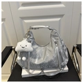 Silver metallic hobo tote bag with a white plush cloud charm and tassel zipper detail - Silver With Pendant
