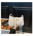 Detail of grey PU leather shoulder bag with gold metal buckle on a wooden bench - Gray