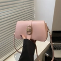 Chic light pink flap shoulder bag with gold oval buckle and sleek faux leather finish - Pink