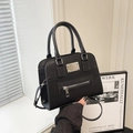 Modern black cross-grain leather tote bag with silver hardware and adjustable strap - Black
