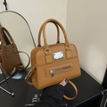 Caramel brown vintage bowling bag in matte leather finish with adjustable strap - Brown