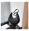 Minimalist black pebble leather crescent shoulder bag with elegant gold zipper detail - Black