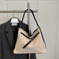 Beige suede tote bag with black cross straps and metal eyelet details for autumn style - Khaki