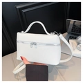 Detailed macro shot of white lychee textured box bag with premium silver hardware and zipper - White
