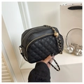 Detail of black quilted leather shoulder bag with double zippers and gold adjustable chain - Black