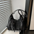 Minimalist black hobo shoulder bag with silver zippers and elegant ribbon bows - Black