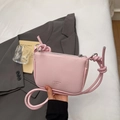 Pink lychee texture crossbody bag with top handle and silver zipper closure - Pink