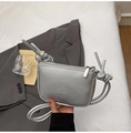 Detail of silver crossbody bag with knot strap and textured leather finish - Silver