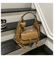 Detail of camel brown crossbody bag featuring white stitching and a plush bear charm - Brown with Pendant
