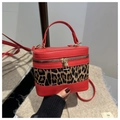 Red faux leather crossbody bag with leopard print panel and gold zipper detail - Red