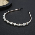 Elegant gold metal headband with hand-wrapped pearls on a minimalist dark background - Pearl Style (FG137) / Gold