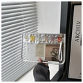 Détail du sac à collation en PVC transparent avec broderie colorée et bordure argentée - Argenté
