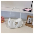 Detail of white PU leather hobo bag with heart rhinestone and golden bow embellishment - White