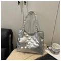 Detail of silver quilted tote bag with heart embossing and woven rope handle - Silver With Pendant