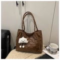 Detail showing brown embossed bear pattern on tote bag with woven handle and plush charm - Brown with Pendant