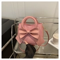 Elegante borsa rosa con grande fiocco e raffinati dettagli dorati per la moda 2025 - Rosa