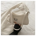 French vintage beige underarm bag with a large silver horseshoe buckle and adjustable strap - White