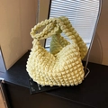 Pale yellow popcorn cloud shoulder bag featuring textured bubble fabric and gold zipper - Yellow