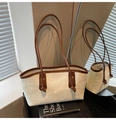 Detail view of cream canvas tote bag with brown straps and FASHION & BAGS lettering - Khaki