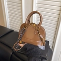 Brown patent leather shell crossbody bag with glossy finish and gold hardware details - With Bell Woven Pendant / Brown