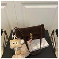 Dark brown suede underarm bag with gold clasp and beige plush pendant accessory - Coffee with Pendant