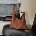 Brown woven hobo tote bag with wide leather strap in a minimalist vintage style - Brown