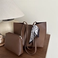 Brown leather tote bag set with matching pouch and scarf on a vintage wooden desk - Dark Brown