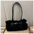 Detail view of black vintage tote bag with suede texture and silver buckle accents - Black