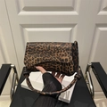Vintage leopard print shoulder bag with flap closure and textured faux leather finish - Brown