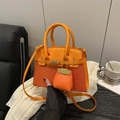 Chic orange structured handbag with crocodile embossed texture and dual handles - Orange