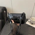 Glossy black patent leather baguette bag with silver zipper and shoulder strap - Black