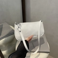 Glossy white faux leather baguette bag with silver hardware and shoulder strap - White