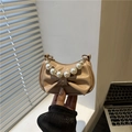 Fashionable beige bow shoulder bag with pearl handle and stylish gold chain accents - Khaki