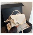 White retro crossbody bag in a black gift box with gold chain strap detail - White