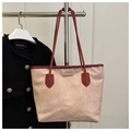Detail of beige suede tote bag with red leather trim and golden metal bar hardware - Pink (No Charm)
