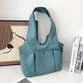 Bolso tote de nailon cian con tres bolsillos delanteros y botones de presión metálicos - Azul