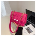 Magenta quilted crossbody bag with diamond stitch pattern and gold chain strap - Pink
