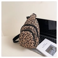 Detail of leopard print crossbody bag with multiple zipper compartments for storage - Leopard Print