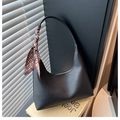 Detail of black pebbled leather hobo bag with stylish printed silk scarf on strap - Black