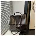 Detail of vintage dark brown backpack with metallic twist-lock and retro faux leather - Coffee No Charm