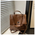 Detail of vintage brown oil wax leather backpack with silver rotating metal lock and flap - Brown No Pendant
