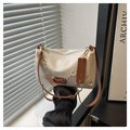 Chic cream-colored shoulder bag with gold clover chain detail and brown strap - White