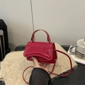 Glossy red faux leather mini square handbag with top handle and crossbody strap - Red