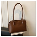 Minimalist brown tote bag in smooth faux leather with stylish wavy edge design - Coffee