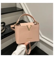 Elegant light pink crossbody bag with gold V-metal buckle and adjustable shoulder strap - Pink