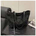 Detail of black tote bag featuring crinkled texture fabric and Tidal Dryness leather logo - Black (No Pendant)