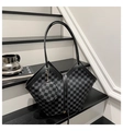 Detail of checkered bucket bag with a matching round coin purse on a minimalist staircase - Black